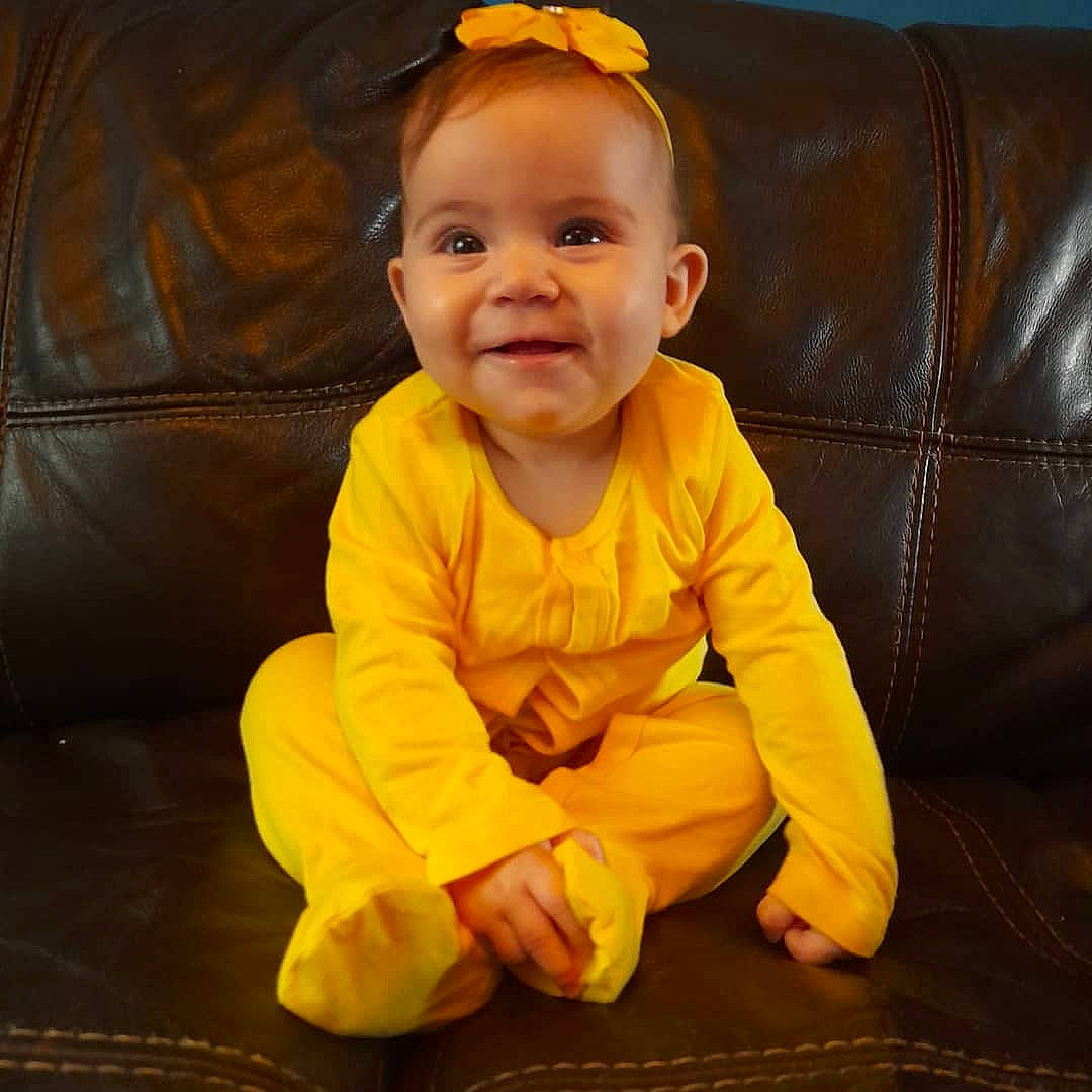 Ellie Mae joined the competition — help win amazing prizes! baby, baby_toddler_clothing, cheek, chin, clothing, eye, face, facial_expression, hair, hairstyle, happy, head, human_body, iris, joy, nose, orange, person, skin, sleeve