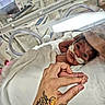 Delilah is registered to the contest to win money with this photo: newborn, baby, incubator, hospital, medical, oxygen_tube, hand, tattoo, foot, blanket, bed, care, love, parent, premature, clinic, patient, infant, tender, person