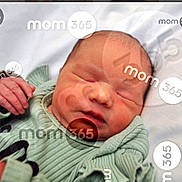 Kaylani is registered to the contest to win money with this photo: baby, closed_eyes, closeup, cute, face, green_clothing, hand, head, indoors, infant, lying_down, newborn, peaceful, portrait, resting, skin, sleeping, soft_fabric, text_overlay, watermark