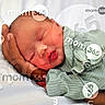 Kaylani is registered to the contest to win money with this photo: baby, baby_wrapped, caring, child, closeup, cute, family, gentle, green_outfit, hand, infant, newborn, parental_hand, peaceful, portrait, resting, skin, sleeping, soft_clothing, tender
