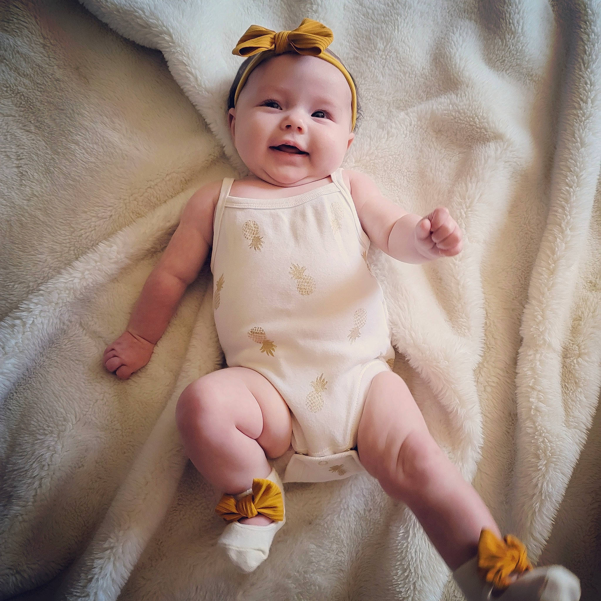 Novaleigh is registered to the contest to win money with this photo: arm, baby, baby_toddler_clothing, comfort, eye, face, facial_expression, foot, happy, headwear, human_body, iris, person, pink, product, skin, sleeve, smile, textile, thumb