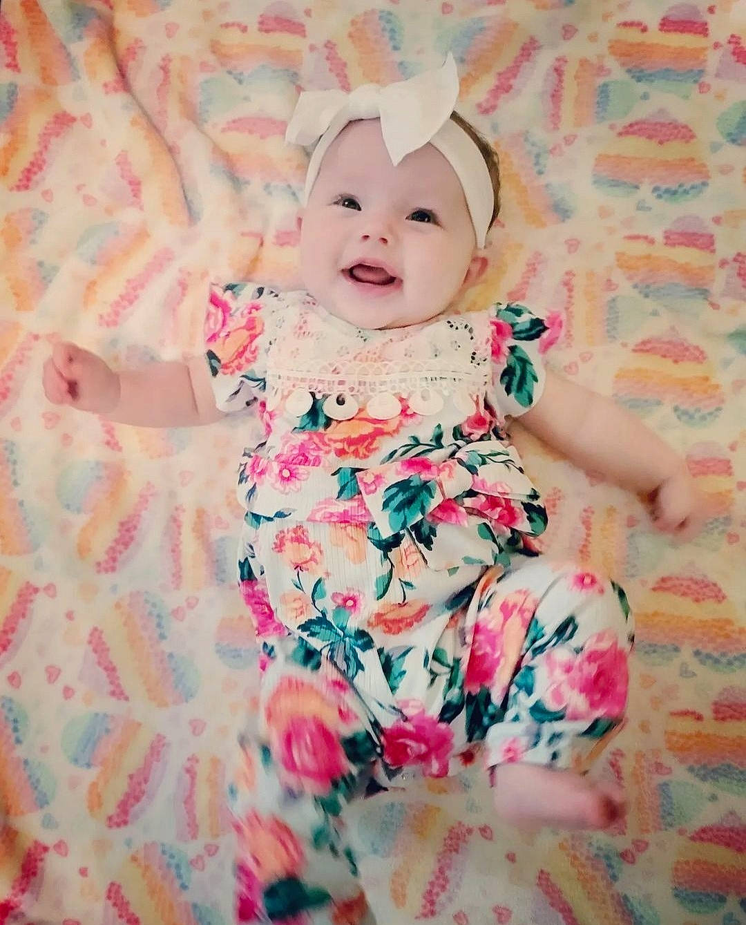 Novaleigh is registered to the contest to win money with this photo: baby, baby_toddler_clothing, cheek, child, day_dress, dress, eye, happy, head, headwear, linens, magenta, pattern, peach, person, petal, pink, skin, sleeve, smile