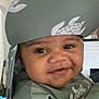 Zayvian joined the competition — help win amazing prizes! baby, child, smiling, headwrap, green_clothing, indoor, face, portrait, cute, happy, person, infant, cozy, living_room, guitar, couch, home, young_child, closeup, apparel