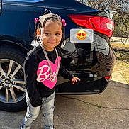 Demylah is registered to the contest to win money with this photo: child, toddler, braids, beads, chain, sweater, jeans, sneakers, car, black_car, wheel, tire, driveway, reflection, outdoor, sunlight, smile, emoji_sticker, accessory, portrait