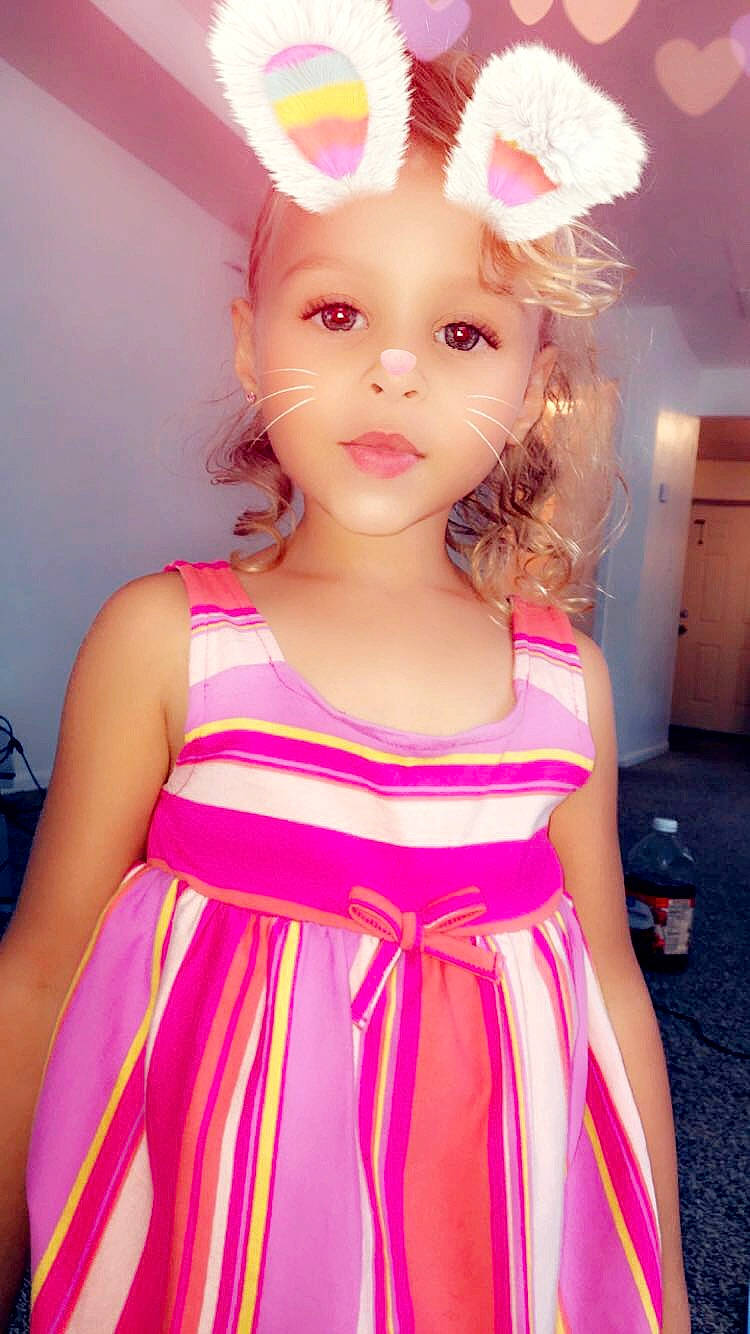 Khalia is registered to the contest to win money with this photo: brown_hair, child, costume, flower, fun, girl, hair_accessory, human_hair_color, magenta, person, pink, skin, smile, toddler