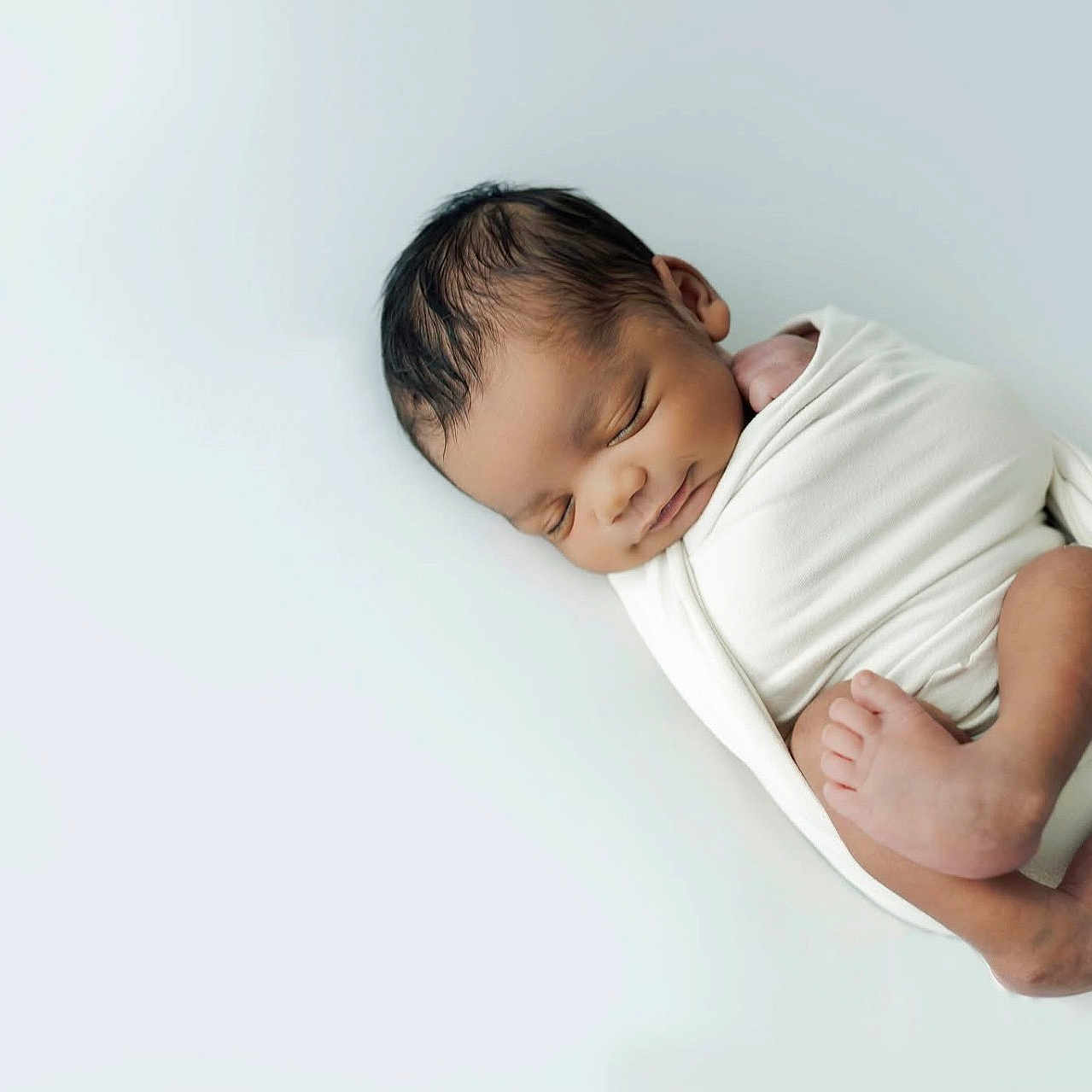 Kamarion joined the competition — help win amazing prizes! newborn, baby, sleeping, wrapped, blanket, infant, peaceful, cozy, soft, portrait, cute, small, human, skin, foot, head, rest, lying, white, minimalist
