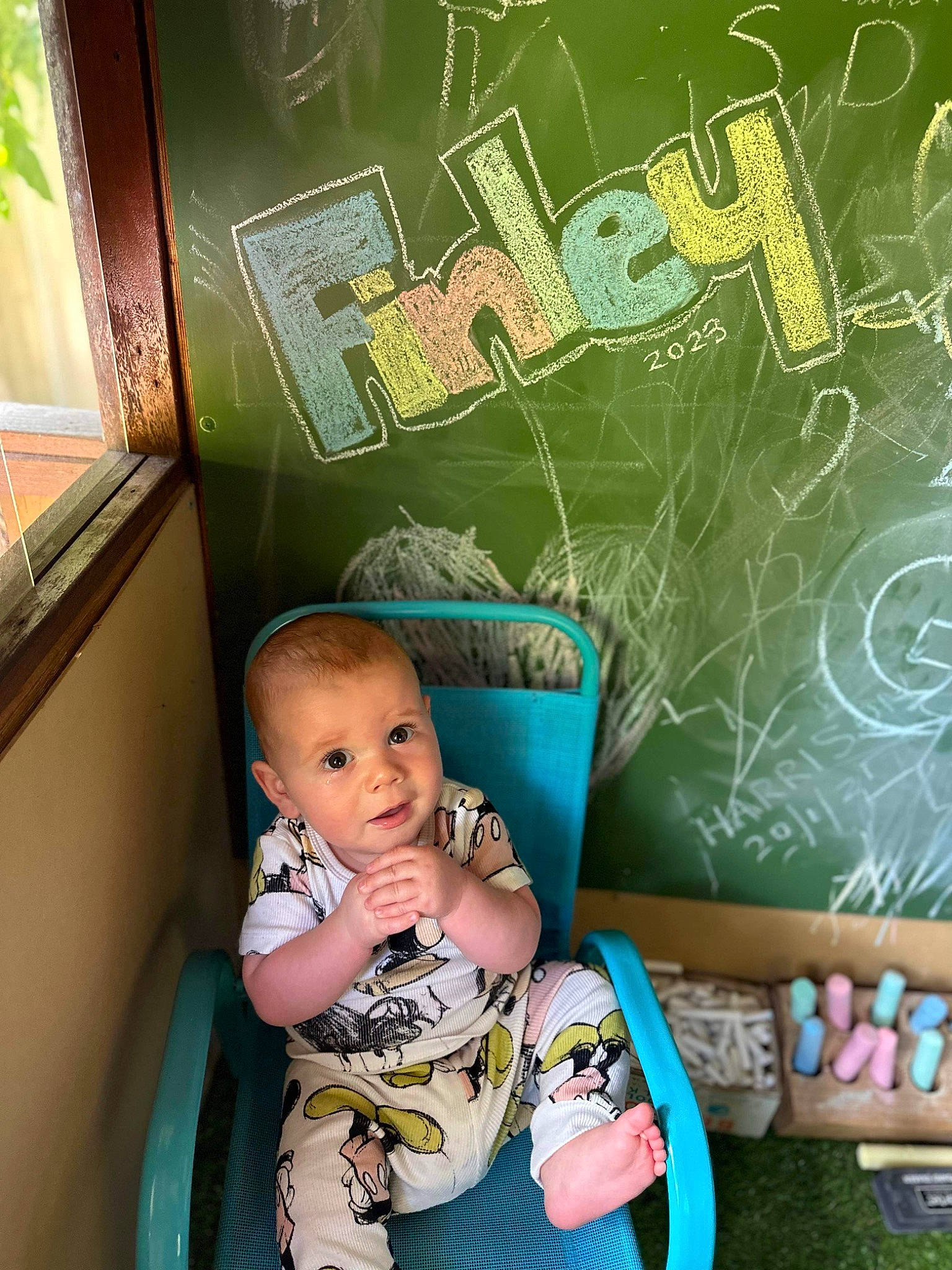 Finley is registered to the contest to win money with this photo: art, baby, baby_products, baby_toddler_clothing, bib, chair, chalk, child, font, fun, green, happy, leisure, pattern, person, picture_frame, play, room, sitting, toddler