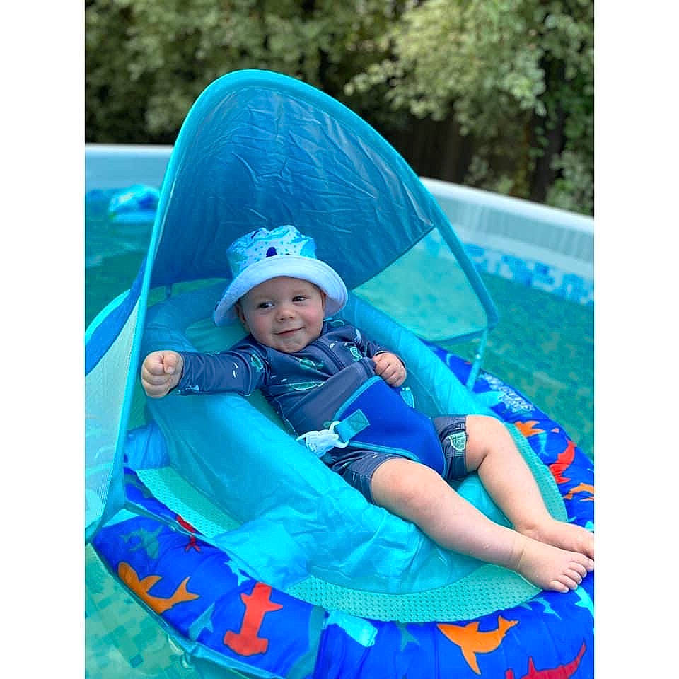 Finley joined the competition — help win amazing prizes! aqua, baby, baby_toddler_clothing, blue, cap, child, electric_blue, fun, grass, happy, headwear, joy, leisure, magenta, pattern, people_in_nature, person, product, recreation, sitting