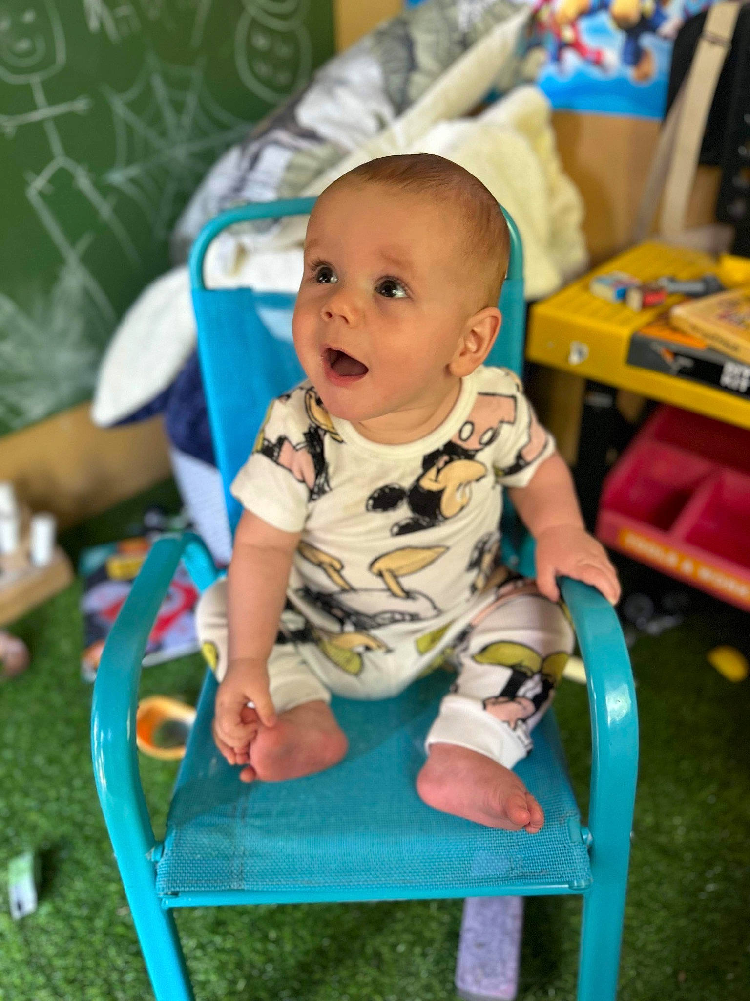 Finley is registered to the contest to win money with this photo: baby, baby_playing_with_toys, baby_products, baby_toddler_clothing, baby_toys, chair, child, electric_blue, fun, grass, happy, leisure, person, play, room, sitting, smile, surprise, toddler, vacation