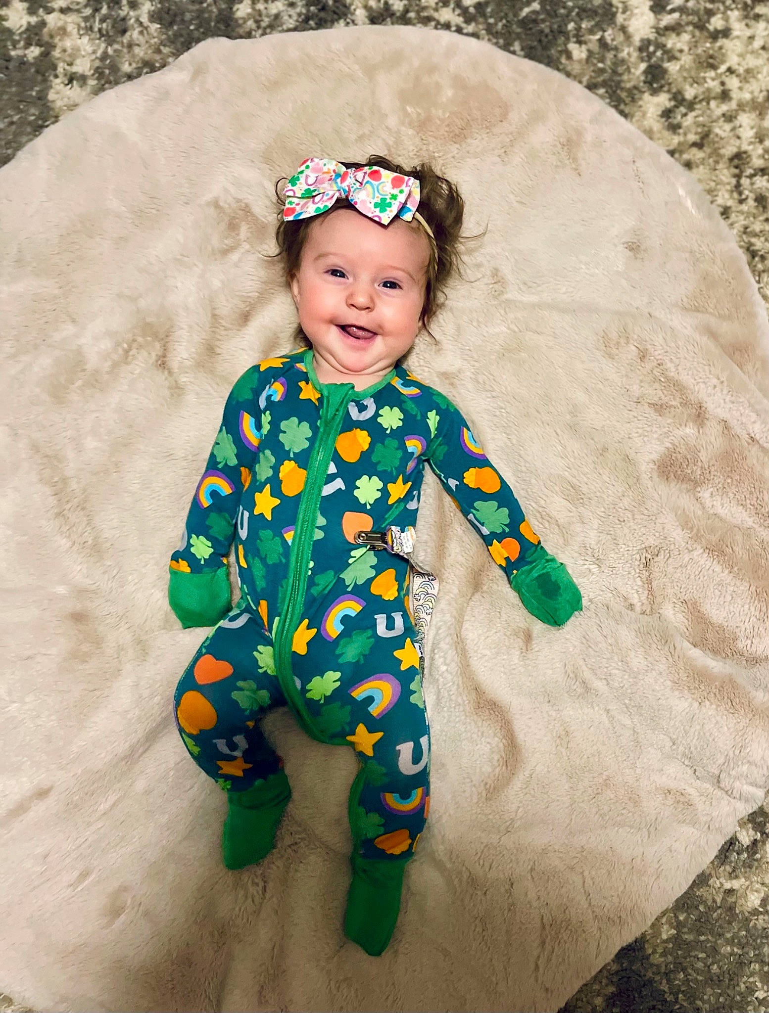 Farrah is registered to the contest to win money with this photo: baby, baby_toddler_clothing, cap, child, costume, costume_hat, face, fashion_accessory, fun, grass, happy, head, headwear, joy, linens, pattern, person, play, sitting, sleeve