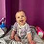 Livia a rejoint le concours — aidez-le/la à gagner de superbes lots ! baby, smiling, child, infant, towel, changing_pad, purple_wall, blue_eyes, happy, sitting, clothing, room, diapers, baby_care, cute, indoors, portrait, skin, hand, foot