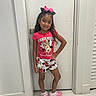 Sophia joined the competition — help win amazing prizes! child, girl, smiling, standing, indoor, door, white_wall, pink_clothing, minnie_mouse, shorts, tshirt, bow, long_hair, shoes, socks, casual, pose, happy, fashion, person