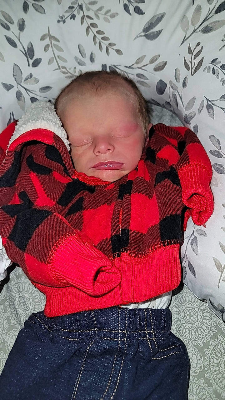 E.j. joined the competition — help win amazing prizes! baby, baby_products, baby_sleeping, baby_toddler_clothing, carmine, child, collar, comfort, design, fashion_accessory, headgear, linens, pattern, person, plaid, red, sitting, sleeve, tartan, textile