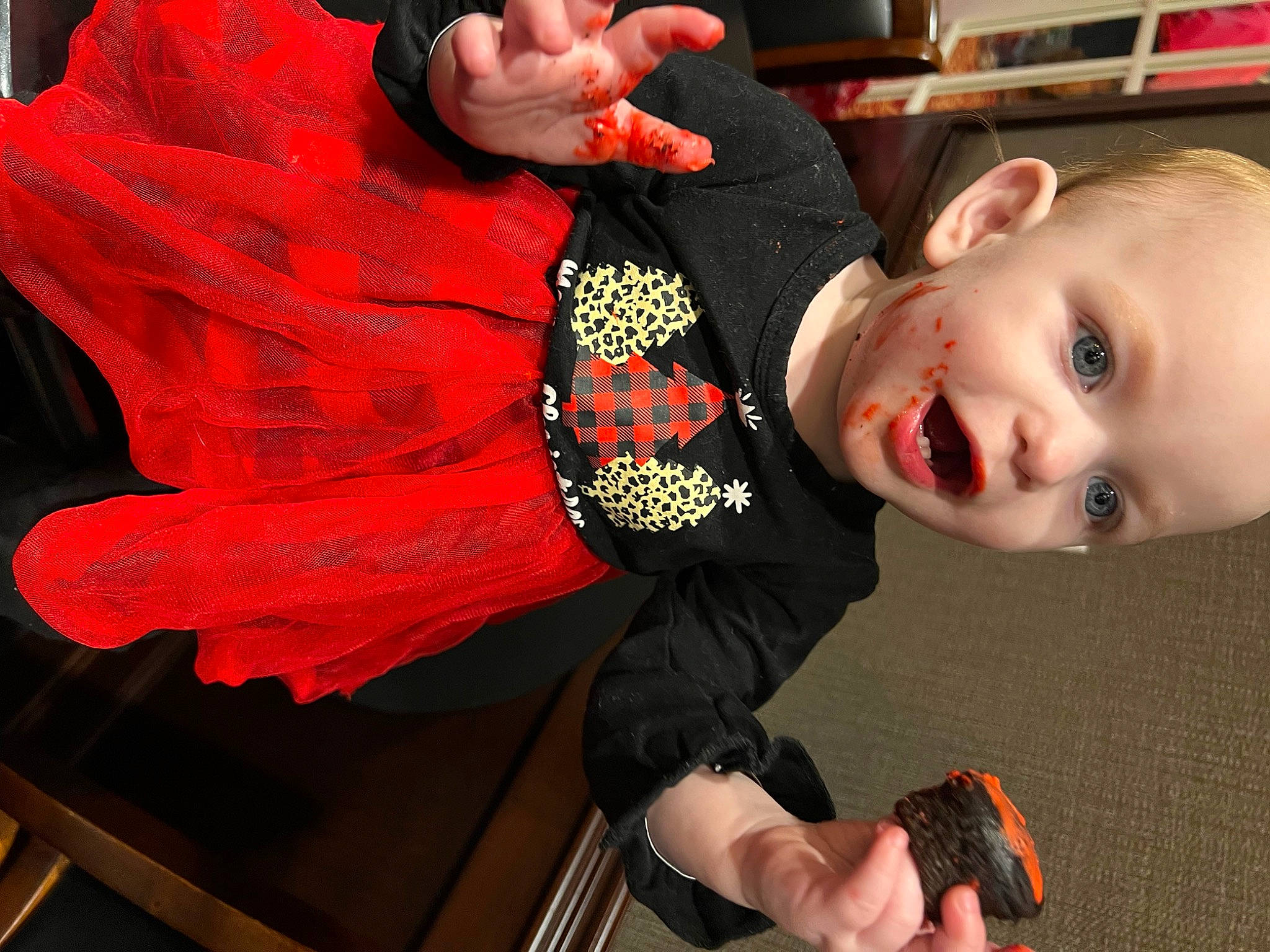 Stella joined the competition — help win amazing prizes! baby, baby_toddler_clothing, carmine, child, elbow, finger, flooring, fun, gesture, happy, mouth, orange, person, play, red, sitting, sleeve, smile, surprise, thumb