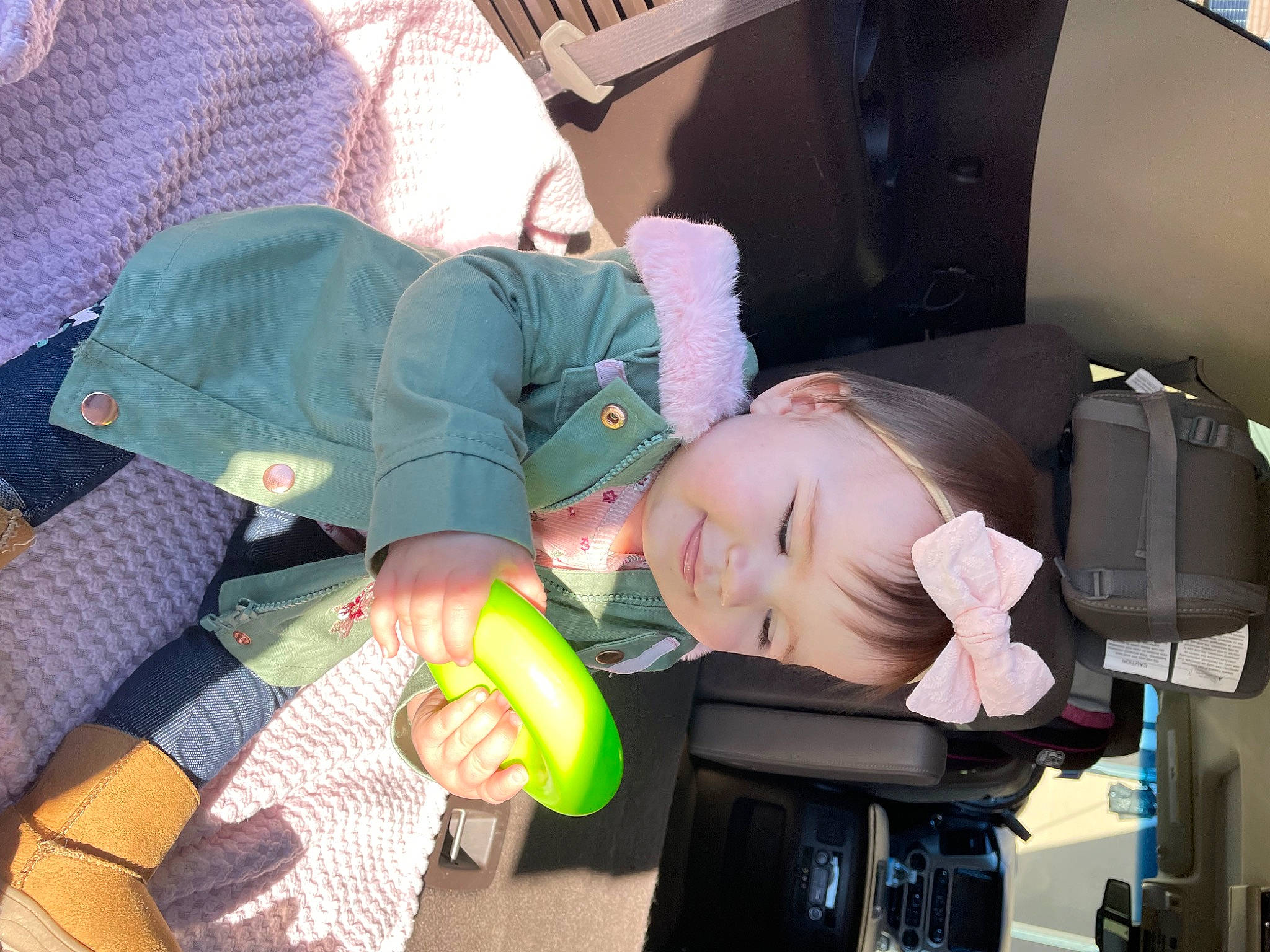 Reagan is registered to the contest to win money with this photo: auto_part, automotive_design, baby, baby_products, car_seat, child, comfort, family_car, fun, head_restraint, lap, luxury_vehicle, motor_vehicle, passenger, person, personal_protective_equipment, room, sitting, suit, thigh