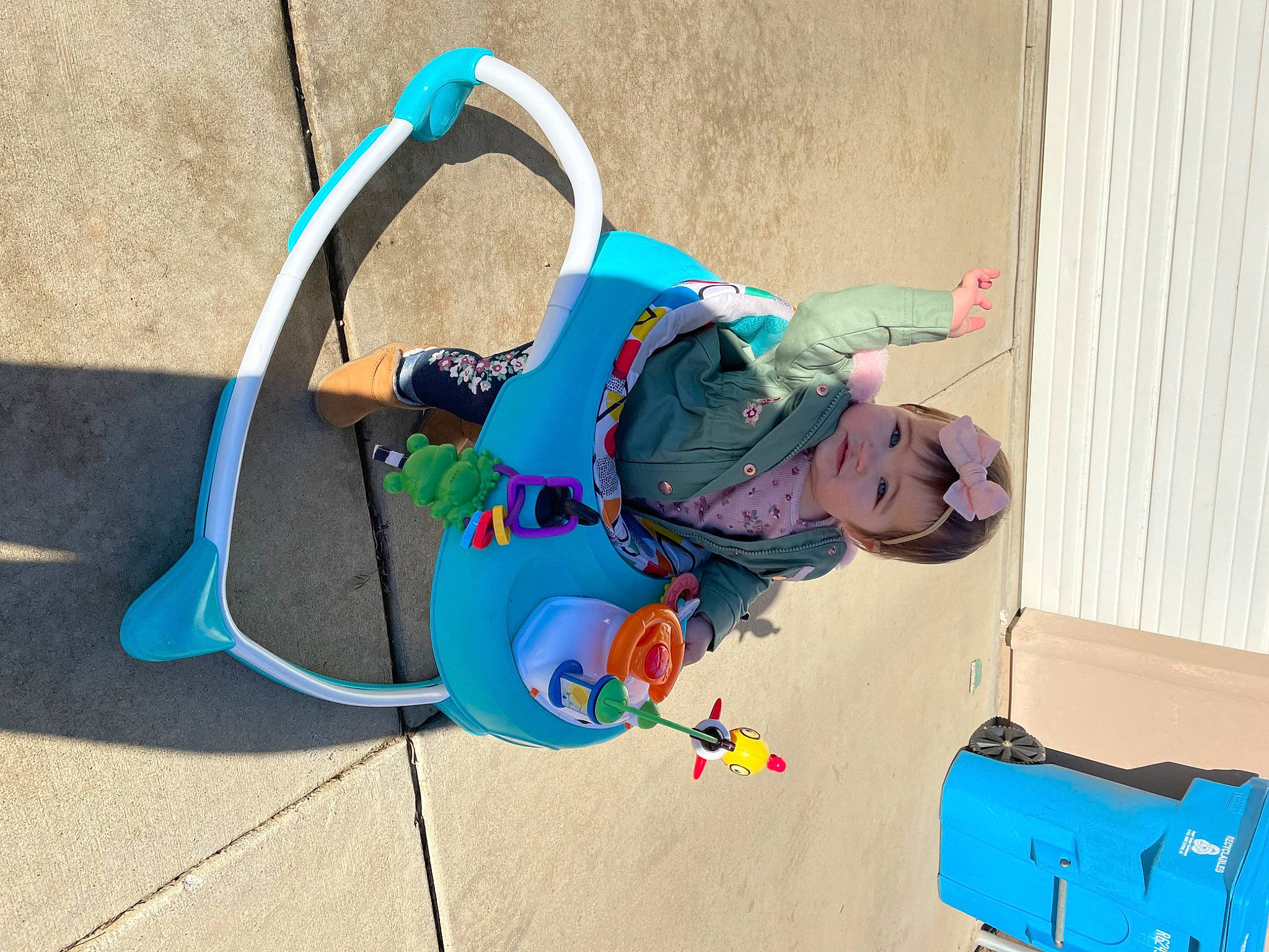 Reagan is registered to the contest to win money with this photo: baby, child, circle, concrete, electric_blue, flooring, fun, leisure, luggage_and_bags, person, plastic, play, recreation, toddler, wire