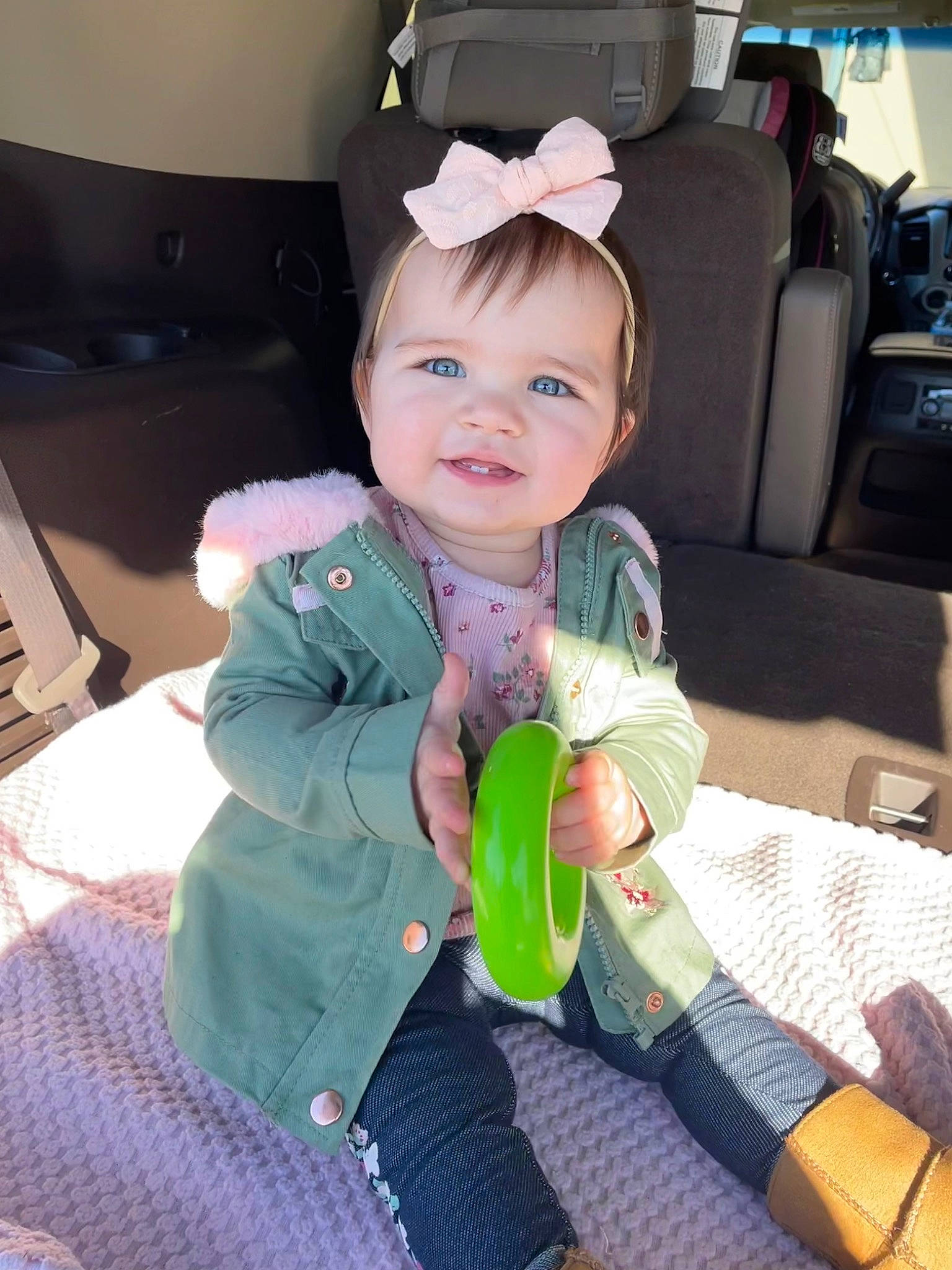 Reagan is registered to the contest to win money with this photo: baby, baby_carriage, baby_in_car_seat, baby_products, baby_toddler_clothing, car_seat, cheek, child, comfort, fashion_accessory, fun, happy, joy, lap, person, room, seat_belt, sitting, skin, smile
