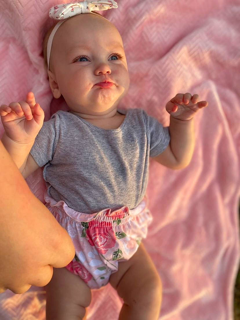 Nevaeh joined the competition — help win amazing prizes! baby_toddler_clothing, cheek, chin, eye, face, finger, gesture, hand, happy, head, human_body, iris, lip, mouth, muscle, neck, nose, organ, person, skin