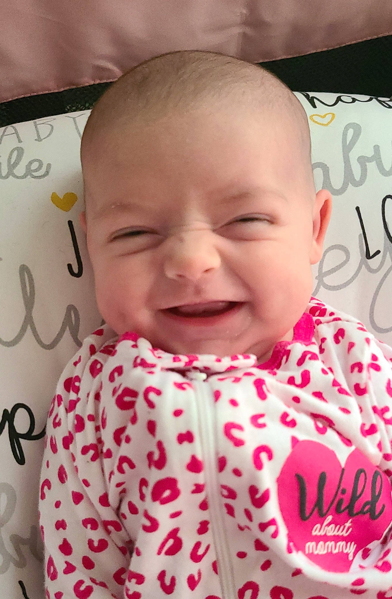 Gemma is registered to the contest to win money with this photo: baby, baby_toddler_clothing, cheek, chin, eye, eyebrow, face, happy, head, joy, lip, neck, nose, outerwear, person, photograph, pink, product, skin, sleeve