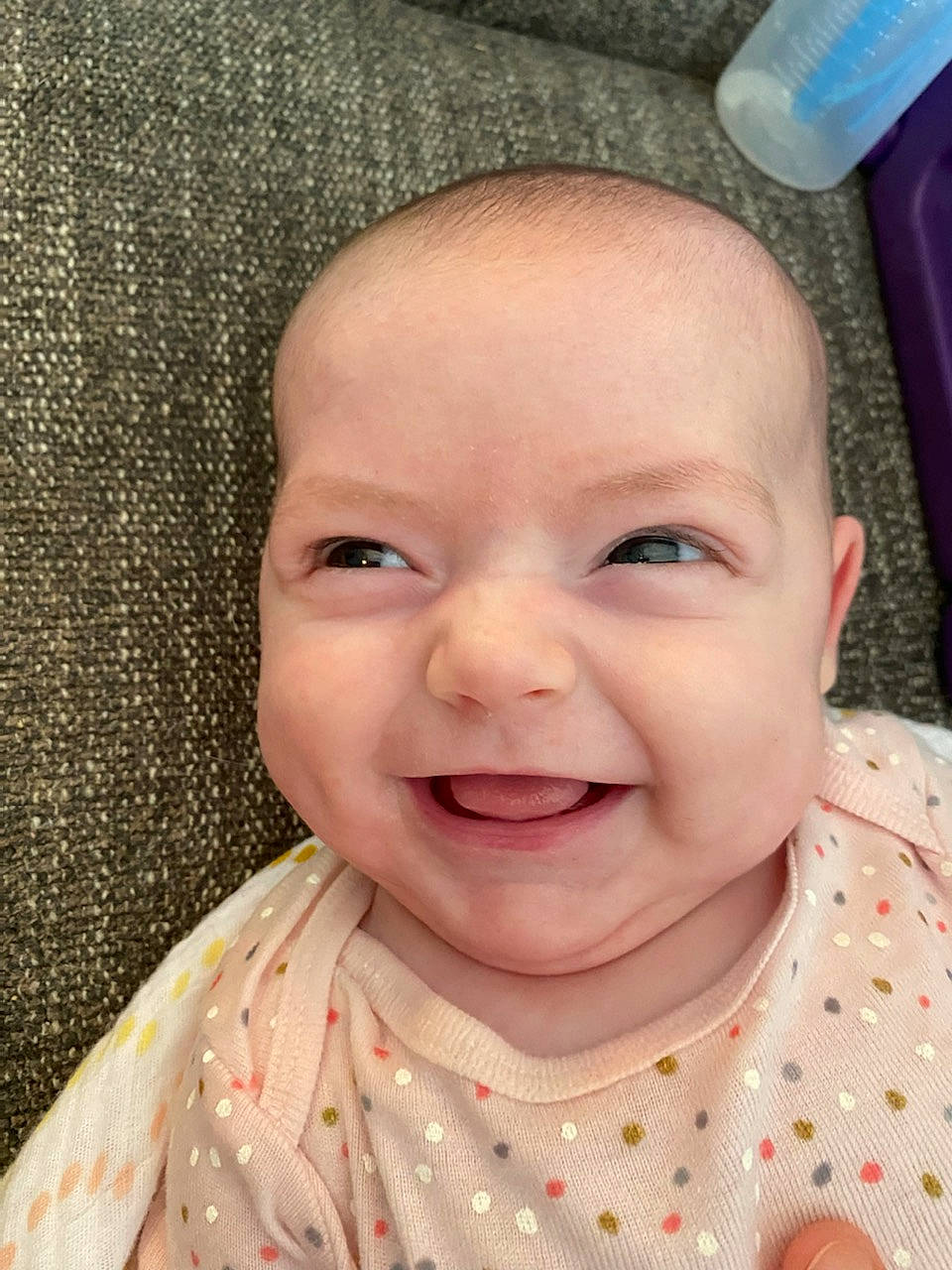 Gemma is registered to the contest to win money with this photo: baby, baby_toddler_clothing, cheek, chin, eye, eyelash, face, facial_expression, forehead, happy, head, iris, joy, lip, mouth, neck, nose, person, pink, skin