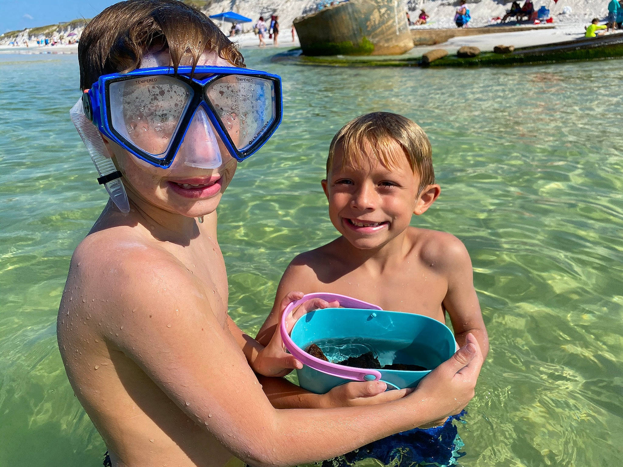 Tyler is registered to the contest to win money with this photo: aqua, azure, blue, cool, diving_equipment, eyewear, fun, goggles, happy, headgear, joy, leisure, muscle, outdoor_recreation, people_on_beach, person, photograph, smile, summer, swimwear