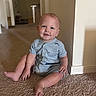baby, child, infant, sitting, smiling, portrait, indoor, home, hallway, carpet, romper, clothing, face, eyes, happy, cute, floor, doorway, wall, photography