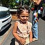 Dariahynis is registered to the contest to win money with this photo: child, girl, curly_hair, outdoor, sunlight, clothing, pink_outfit, sunglasses, purse, person, street, car, adult, jeans, footwear, shadow, earrings, smile, summer, accessory
