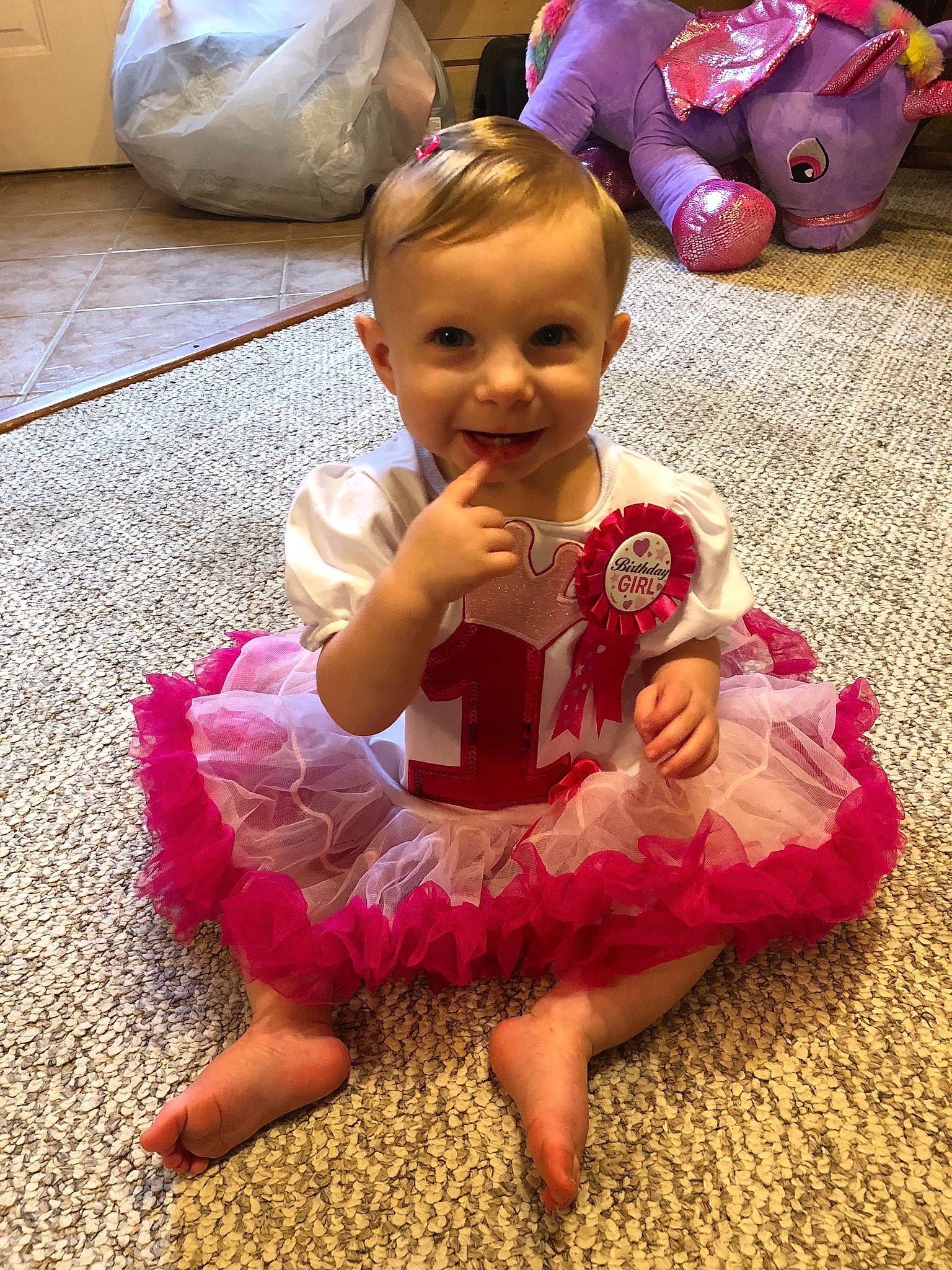 Sadie joined the competition — help win amazing prizes! baby, baby_toddler_clothing, child, day_dress, dress, event, facial_expression, flooring, fun, happy, joy, magenta, person, pink, play, purple, sitting, skin, smile, textile