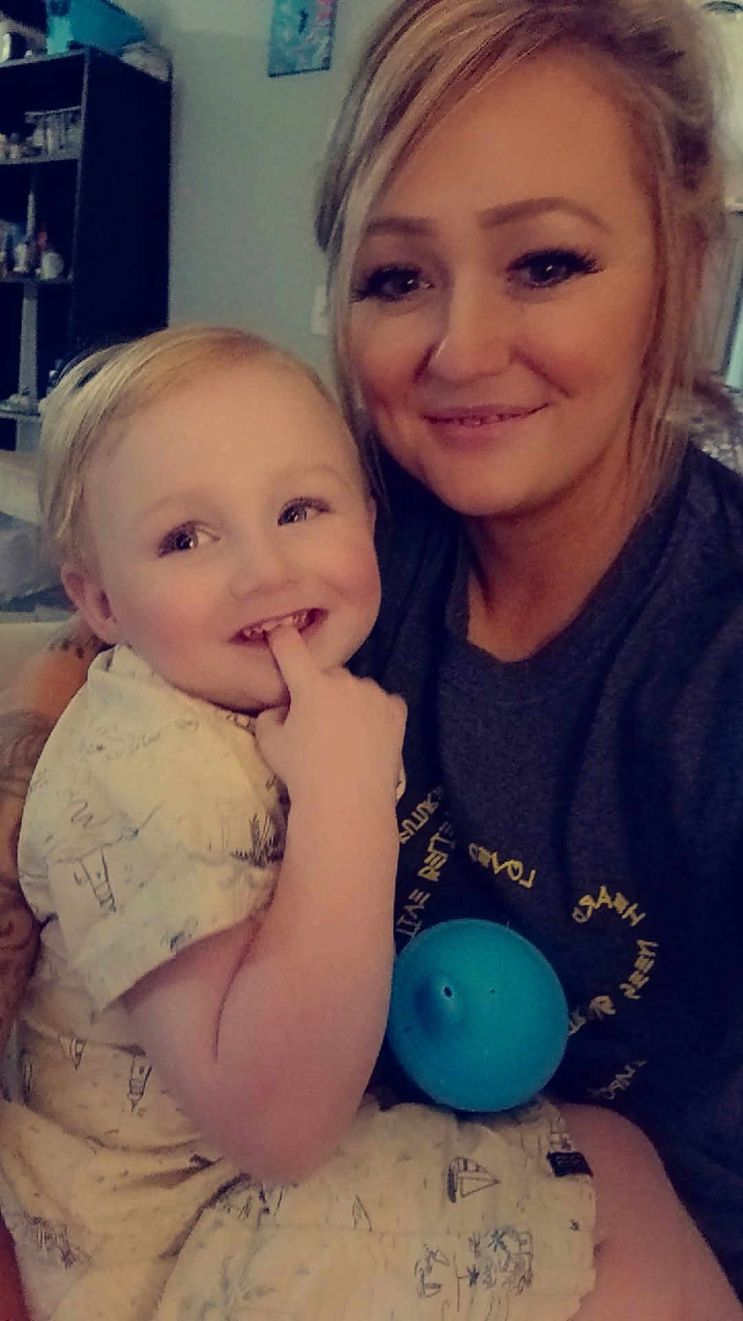 Maddox joined the competition — help win amazing prizes! child, toddler, woman, indoor, smiling, face, person, holding, sippy_cup, furniture, shelf, clothing, blond_hair, happy, portrait, family, casual, home, cute, baby