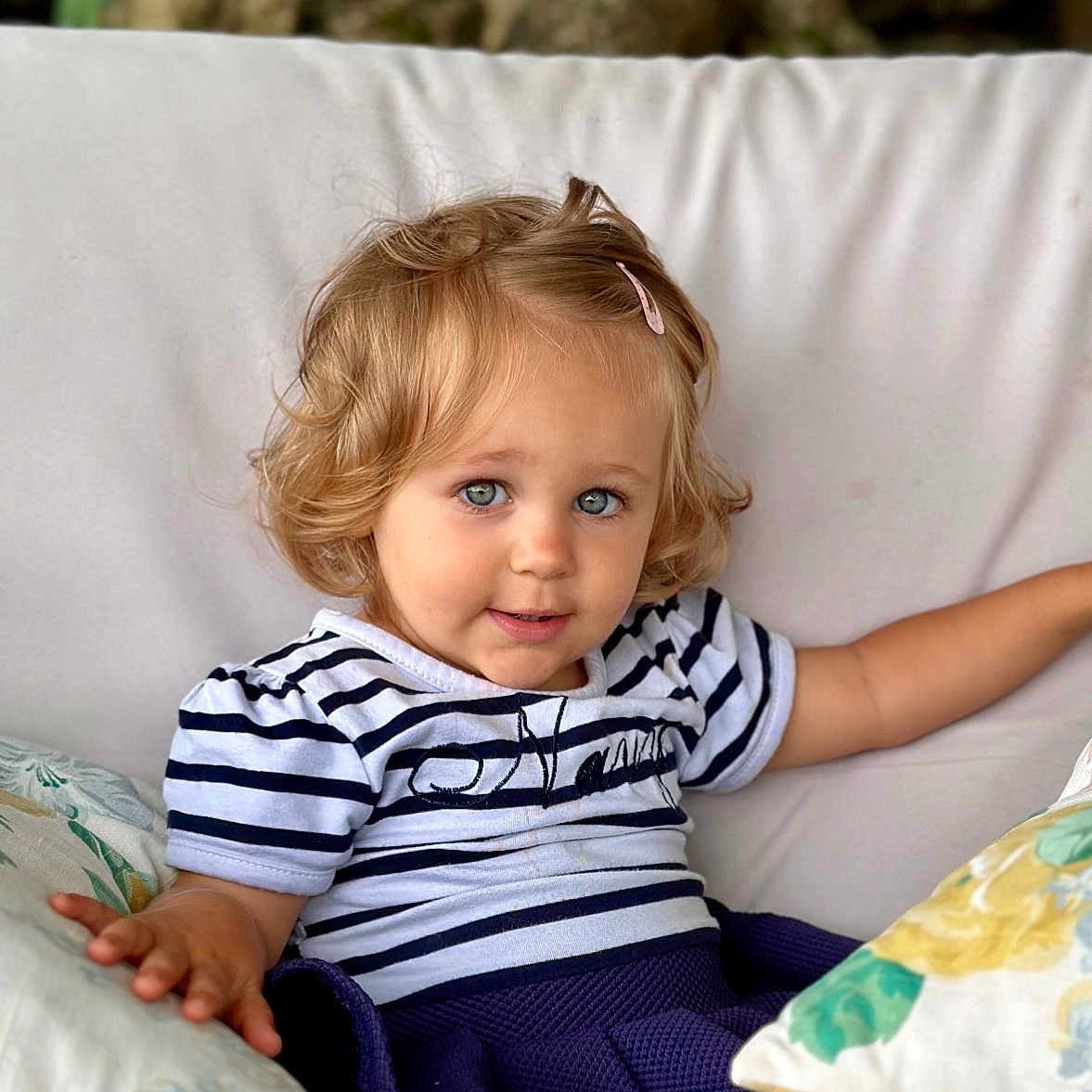 Mélodie participe au concours pour gagner de l'argent avec cette photo : baby, blonde, bodypart, clothing, couch, cushion, face, finger, footwear, furniture, hair, head, homedecor, pants, person, photography, pillow, portrait, shoe, sitting