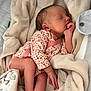 Maïly participe au concours pour gagner de l'argent avec cette photo : newborn, baby, sleeping, blanket, onesie, floral_pattern, infant, soft_texture, cozy, cute, peaceful, skin, hand, foot, indoors, portrait, closeup, resting, child, toddler