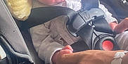 Riker joined the competition — help win amazing prizes! baby, newborn, car_seat, infant, child, seatbelt, safety, hand, adult, yellow_headrest, clothing, cute, portrait, indoor, person, bonding, family, newborn_care, car, baby_carrier