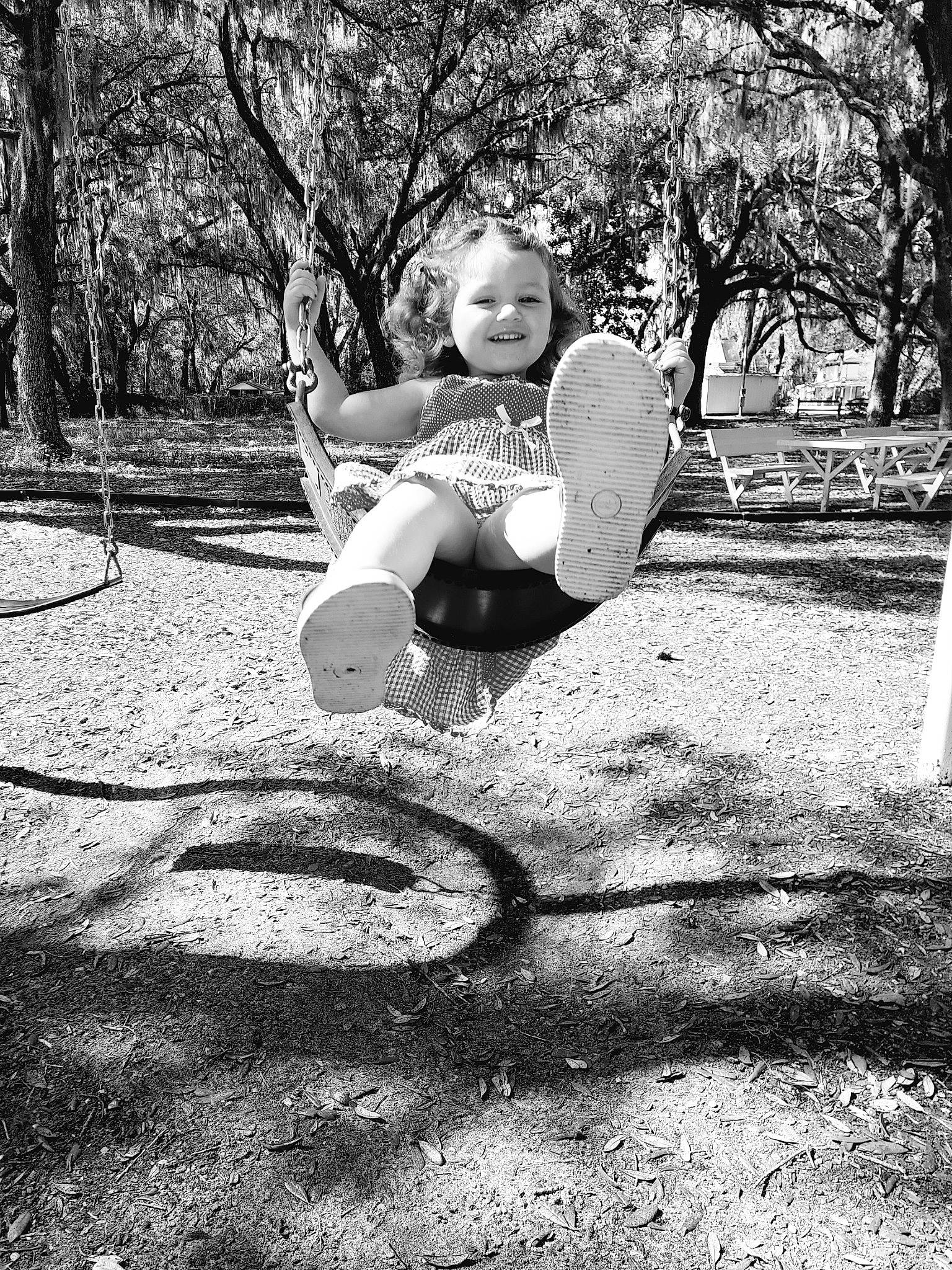 Oaklyn joined the competition — help win amazing prizes! automotive_tire, flash_photography, forest, fun, grass, happy, joy, leisure, monochrome, monochrome_photography, people_in_nature, person, plant, recreation, shorts, sneakers, style, sunlight, swing, tints_and_shades