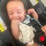 Bryan joined the competition — help win amazing prizes! baby, car_seat, infant, smiling, blanket, child, seatbelt, safety, hand, clothing, happy, face, cute, indoors, rest, comfort, baby_toy, pacifier_clip, closeup, portrait