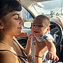 Bryan joined the competition — help win amazing prizes! baby, woman, car, smiling, sunlight, joyful, holding, seat, window, interior, clothing, face, person, happy, portrait, hand, necklace, black_hair, infant, seatbelt