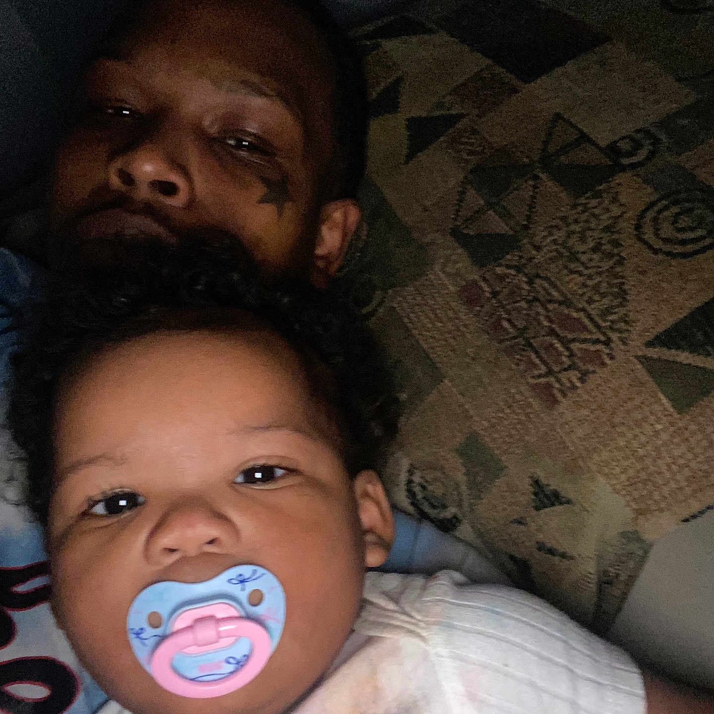 Janaya joined the competition — help win amazing prizes! adult, baby, candid, casual, child, closeup, clothing, curly_hair, face, family, indoor, pacifier, pattern, person, pillow, portrait, relaxed, skin, sleepy, tattoo