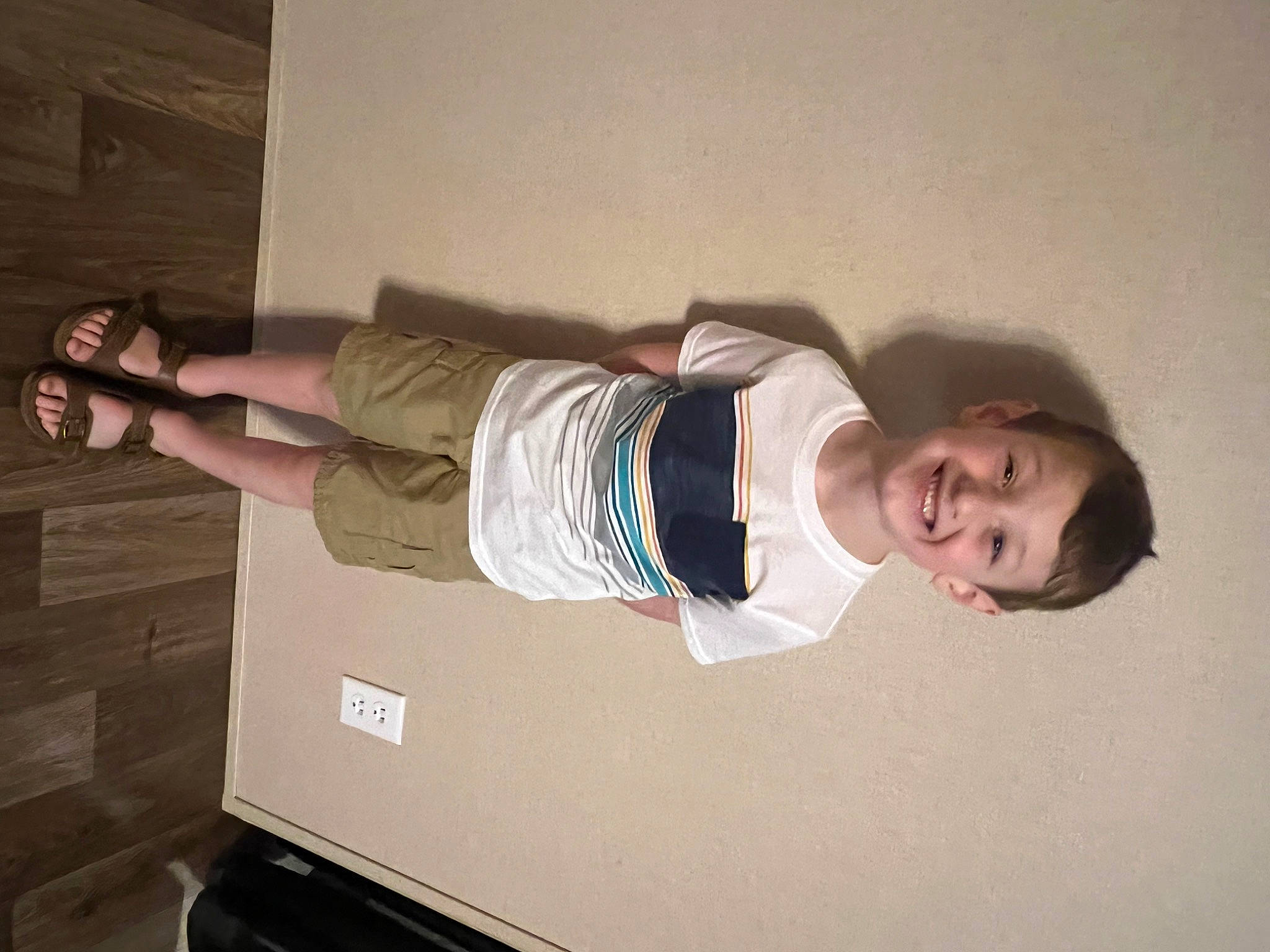 Braiden is registered to the contest to win money with this photo: ceiling, comfort, elbow, flash_photography, fun, hardwood, human_leg, joy, knee, person, plaster, room, shoulder, smile, t_shirt, thigh, waist, wall, wood, wrist