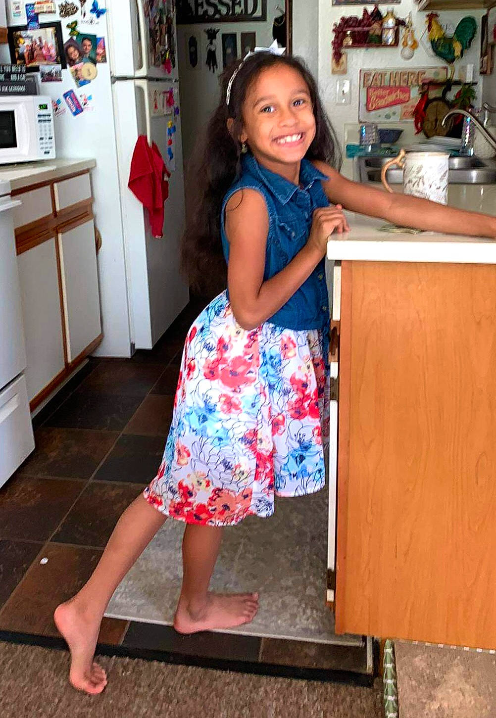 Emma joined the competition — help win amazing prizes! child, dress, face, floor, flooring, hair, home_appliance, joint, joy, kitchen_appliance, knee, leg, leisure, person, sandal, shoe, shoulder, smile, standing, thigh