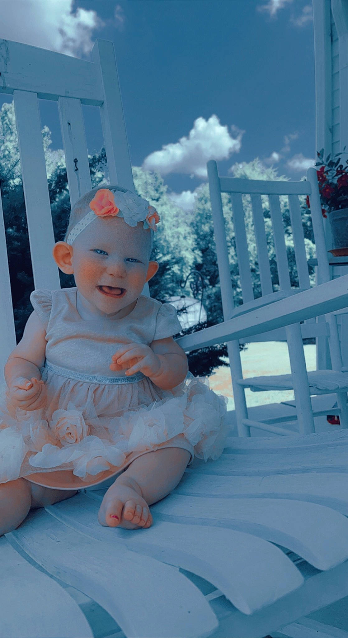 Natalie is registered to the contest to win money with this photo: azure, baby, baby_toddler_clothing, cloud, electric_blue, fashion_accessory, fence, fun, happy, hat, headband, headpiece, headwear, human_body, leisure, person, recreation, room, sitting, sky