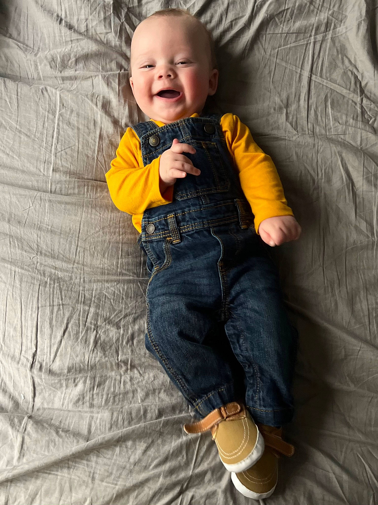 Luka is registered to the contest to win money with this photo: arm, baby_toddler_clothing, chin, comfort, dress, eye, face, finger, hand, happy, head, human_body, jeans, leg, nose, person, skin, sleeve, smile, textile