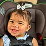 Kataleia joined the competition — help win amazing prizes! toddler, child, car_seat, smiling, bow, hair_accessory, seatbelt, blue_dress, gold_necklace, happy, cute, face, portrait, baby, safety, indoors, closeup, young_child, person, infant
