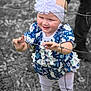 toddler, child, girl, headband, flower, dress, wire_fence, curious, outdoor, grass, leaves, legs, adult, white_shoes, playful, color_pop, black_and_white_background, nature, standing, portrait