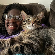 Rylo joined the competition — help win amazing prizes! casual, cat, closeup, comfort, couch, cozy, feline, friendship, fur, glasses, happy, home, indoor, leisure, person, portrait, relaxation, resting, smile, tabby_cat