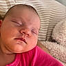 Ayla joined the competition — help win amazing prizes! baby, sleeping, infant, portrait, face, pink_outfit, bed, bedding, striped_blanket, pillow, plush_toy, cozy, indoors, bedroom, peaceful, resting, closed_eyes, child, photography, close_up