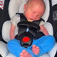 Elijah joined the competition — help win amazing prizes! newborn, baby, sleeping, car_seat, safety_harness, blue_pants, grey_shirt, infant, tiny_toes, head_support, black_fabric, close_up, indoors, child, peaceful, resting, seat_belt, baby_clothing, soft_padding, infant_care