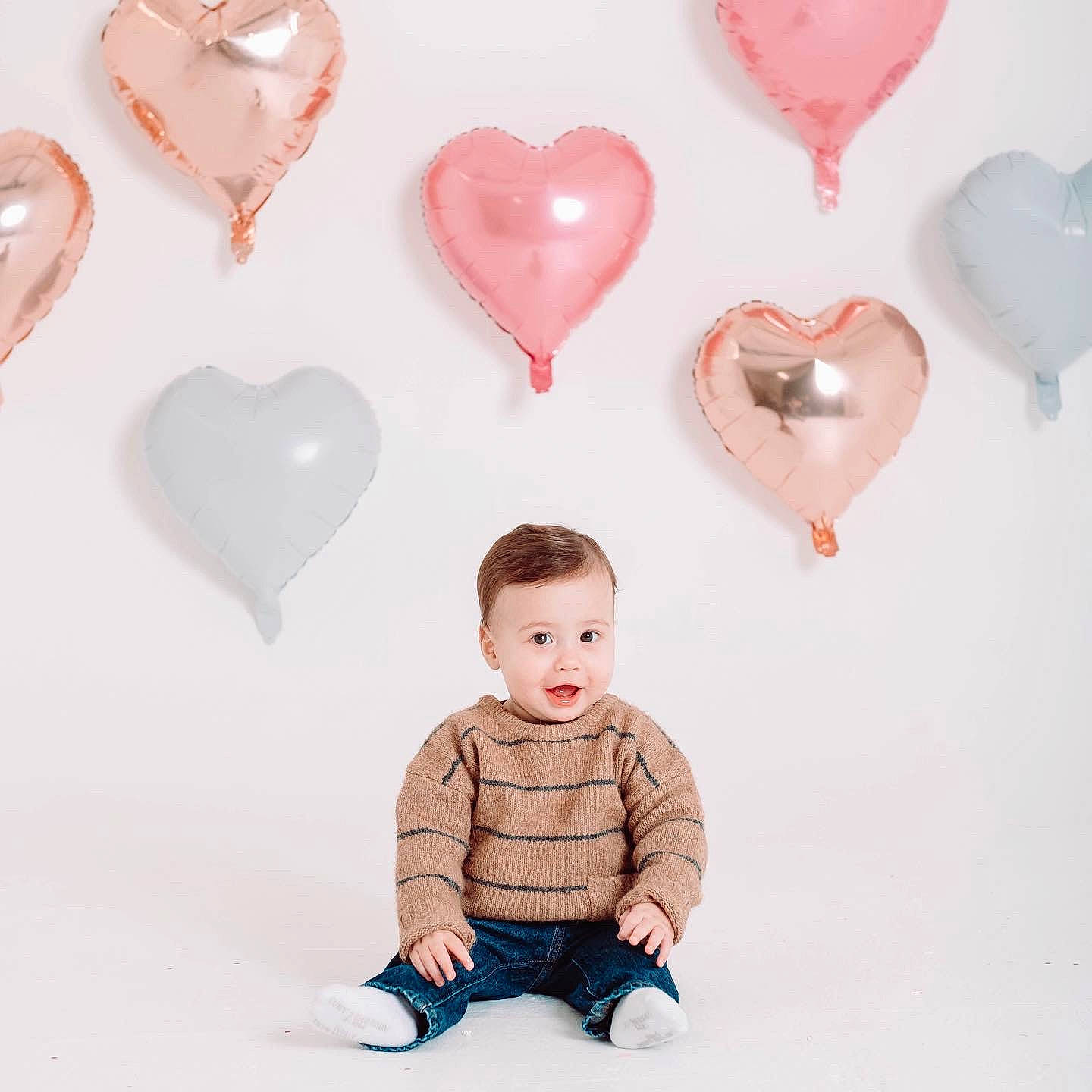 Luciano joined the competition — help win amazing prizes! baby_toddler_clothing, child, event, gesture, happy, heart, holiday, human_body, love, organ, ornament, party_supply, pattern, person, pink, red, sitting, sleeve, sweetness, toddler