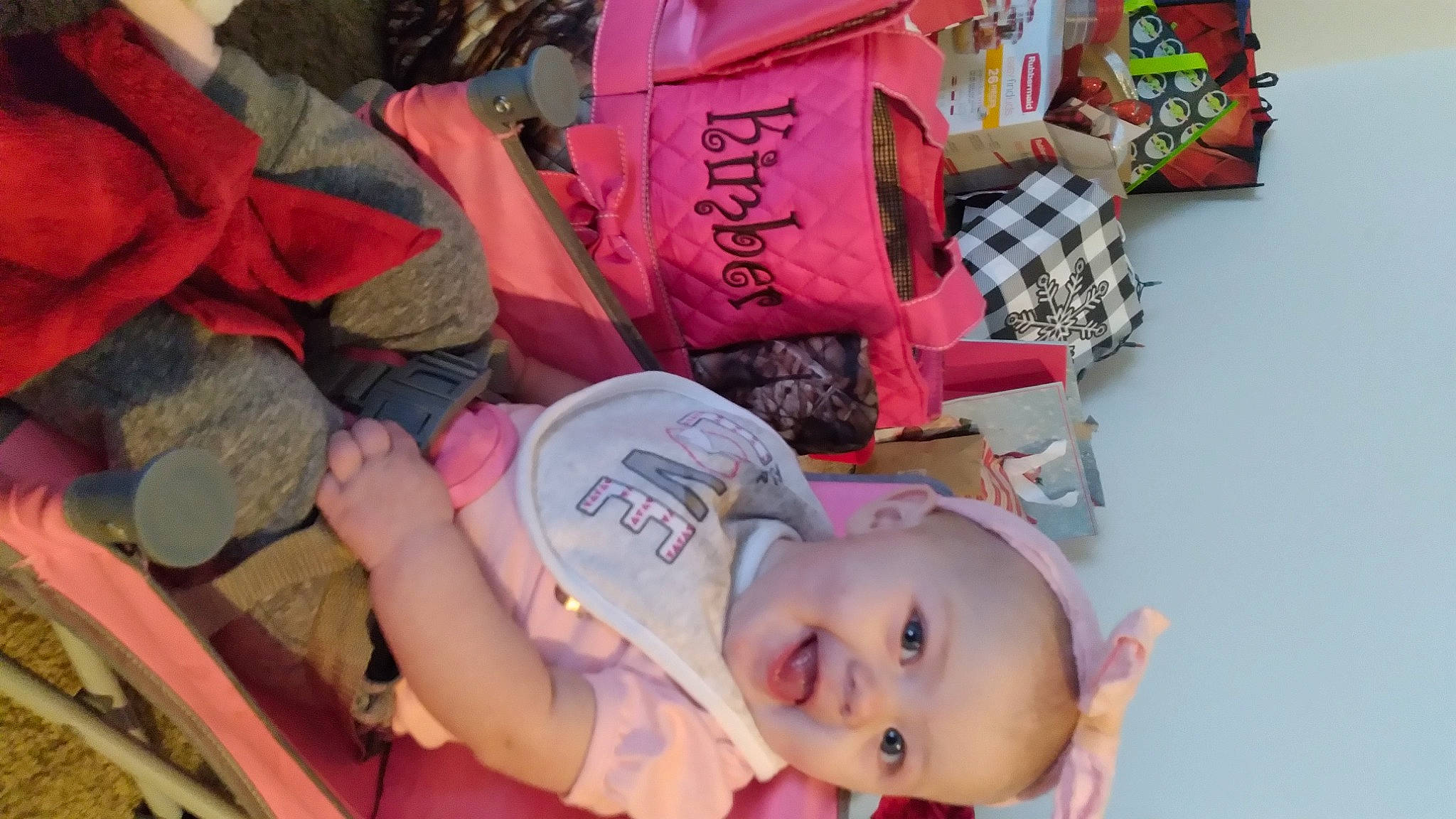 Kimber is registered to the contest to win money with this photo: baby, carmine, child, event, fun, happy, headgear, leisure, linens, magenta, mouth, pattern, person, pink, product, red, skin, smile, t_shirt, thigh