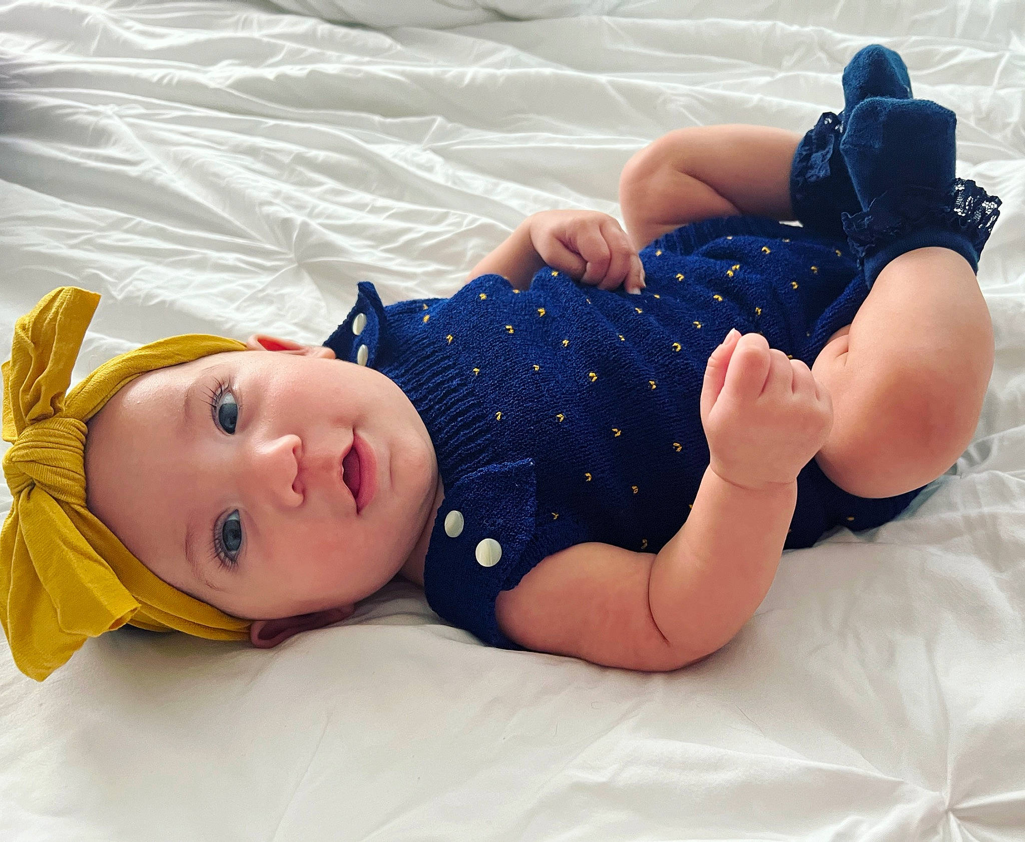 Ariella joined the competition — help win amazing prizes! baby, baby_sleeping, baby_toddler_clothing, barefoot, child, comfort, foot, happy, hat, head, headwear, human_body, human_leg, knee, linens, pattern, person, sitting, skin, sleeve