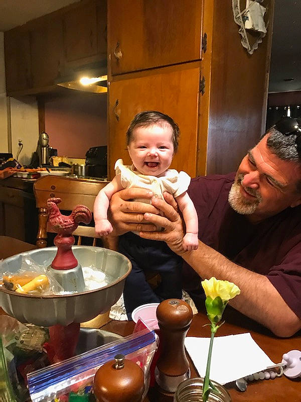 Scarlett is registered to the contest to win money with this photo: baby, bowl, cooking, countertop, cuisine, dessert, dish, drink, event, food, happy, joy, kitchen, kitchen_dining_room_table, person, plate, smile, table, tableware, thumb