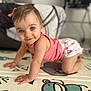 baby, child, crawling, blue_eyes, pink_clothing, play_mat, cartoon_monkey, smile, indoor, cute, infant, young_child, cheerful, person, closeup, baby_girl, soft_focus, floor, home, adorable